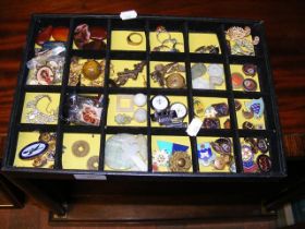 A tray of collectables, including charms, pocket w