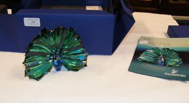 A boxed Swarovski crystal peacock ornament 'Arya'