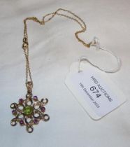 A gold peridot, amethyst and pearl mounted pendant