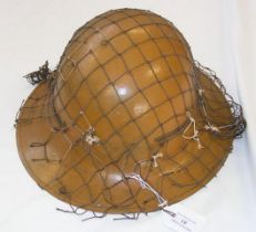 A Zuckerman steel helmet manufactured by The Press