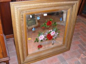 A Victorian painted mirror in gilt surround