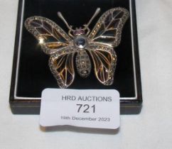 A silver butterfly brooch set with marcasite, sapp