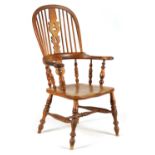 A 19TH CENTURY BROAD ARM ASH AND ELM WINDSOR CHAIR