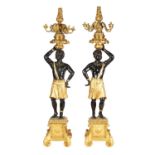 A FINE PAIR OF 18TH CENTURY CARVED GILT GESSO AND POLYCHROME PAINTED BLACKAMOOR TORCHERES OF LARGE S