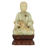 A 17TH/18TH CENTURY CHINESE JADE FIGURE OF BUDDHA ON LATER BASE