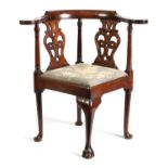 A GOOD GEORGE II WALNUT CORNER CHAIR