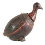 AN UNUSUAL CARVED COCONUT LIDDED POLYCHROME DECORATED CANISTER FORMED AS A BIRD