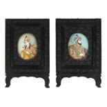 A PAIR OF 19TH CENTURY INDIAN MINIATURES ON IVORY IN CARVED EBONY FRAMES