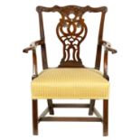 A GEORGE III MAHOGANY CHIPPENDALE STYLE OPEN ARMCHAIR OF GENEROUS SIZE