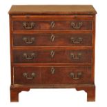 A GEORGE III MAHOGANY CHEST OF DRAWERS OF SMALL SIZE