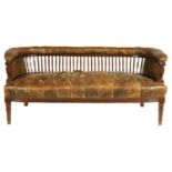 A 19TH CENTURY LEATHER BUTTON UPHOLSTERED AND WALNUT FRAMED TWO SEATER SETTEE