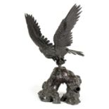 A JAPANESE MEIJI PERIOD PATINATED BRONZE SCULPTURE OF AN EAGLE