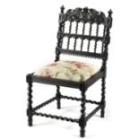 A LATE 19TH CENTURY INDIAN STYLE EBONISED CHAIR