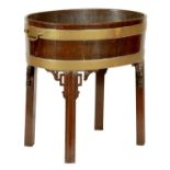 A GOOD GEORGE III MAHOGANY CHIPPENDALE STYLE OVAL WINE COOLER ON STAND