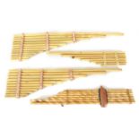 A COLLECTION OF FOUR VARIOUS SIZE BAMBOO PANPIPES