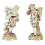 A PAIR OF EARLY 20TH CENTURY CONTINENTAL PORCELAIN FIGURAL MATCH HOLDERS