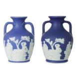 A PAIR OF WEDGWOOD DARK BLUE JASPER WARE MODEL OF THE PORTLAND VASE CIRCA 1900