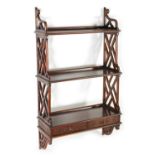 A SET OF 19TH CENTURY CHIPPENDALE STYLE MAHOGANY HANGING SHELVES