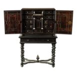 A 17TH CENTURY EBONY AND IVORY INLAID TABLE CABINET
