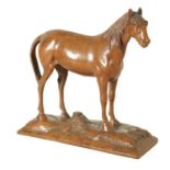 A 19TH CENTURY CARVED LINDEN WOOD BLACK FOREST SCULPTURE OF A HORSE