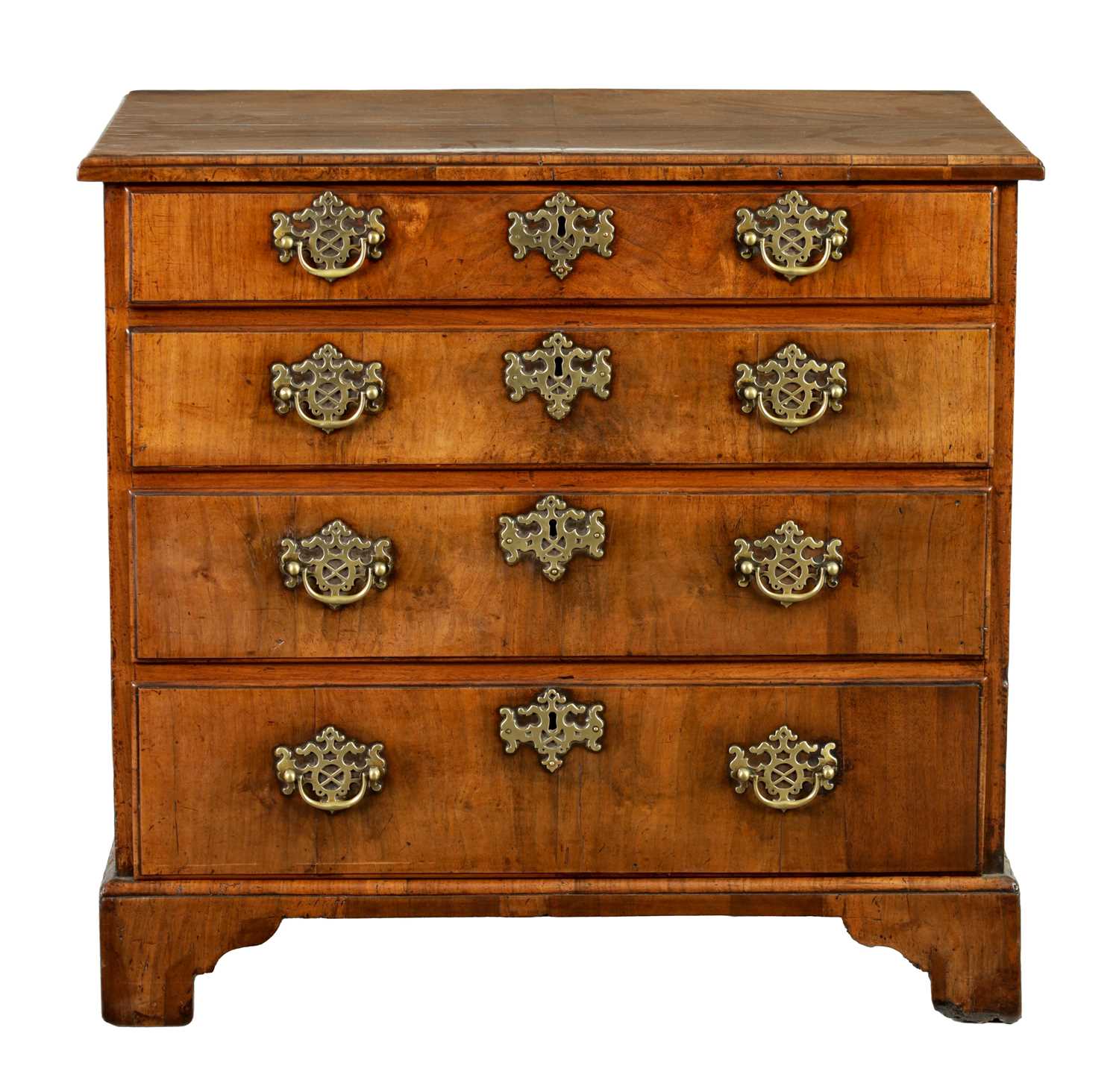 A GEORGE II WALNUT CHEST OF DRAWERS