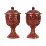 A PAIR OF 18TH/19TH CENTURY CHINESE CINNABAR LACQUER URN-SHAPED LIDDED VASES