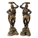 A PAIR OF 19TH CENTURY CARVED POLYCHROME DECORATED BLACKAMOORS