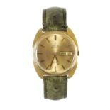 AN 18CT GOLD OMEGA DAY/DATE WRISTWATCH