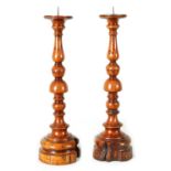 A PAIR OF 18TH/19TH CENTURY TURNED YEW WOOD PRICKET STICKS