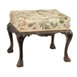 AN EARLY GEORGE III CHIPPENDALE CARVED MAHOGANY UPHOLSTERED STOOL