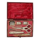 A 19TH-CENTURY CASED EMBOSSED SILVER SEWING COMPENDIUM