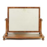 A 19TH CENTURY FLAME MAHOGANY BOW FRONTED TOILET MIRROR IN THE MANNER OF GILLOWS