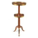 AN EARLY 19TH CENTURY FRENCH SATINWOOD AND MAHOGANY CIRCULAR TWO-TIER OCCASIONAL TABLE