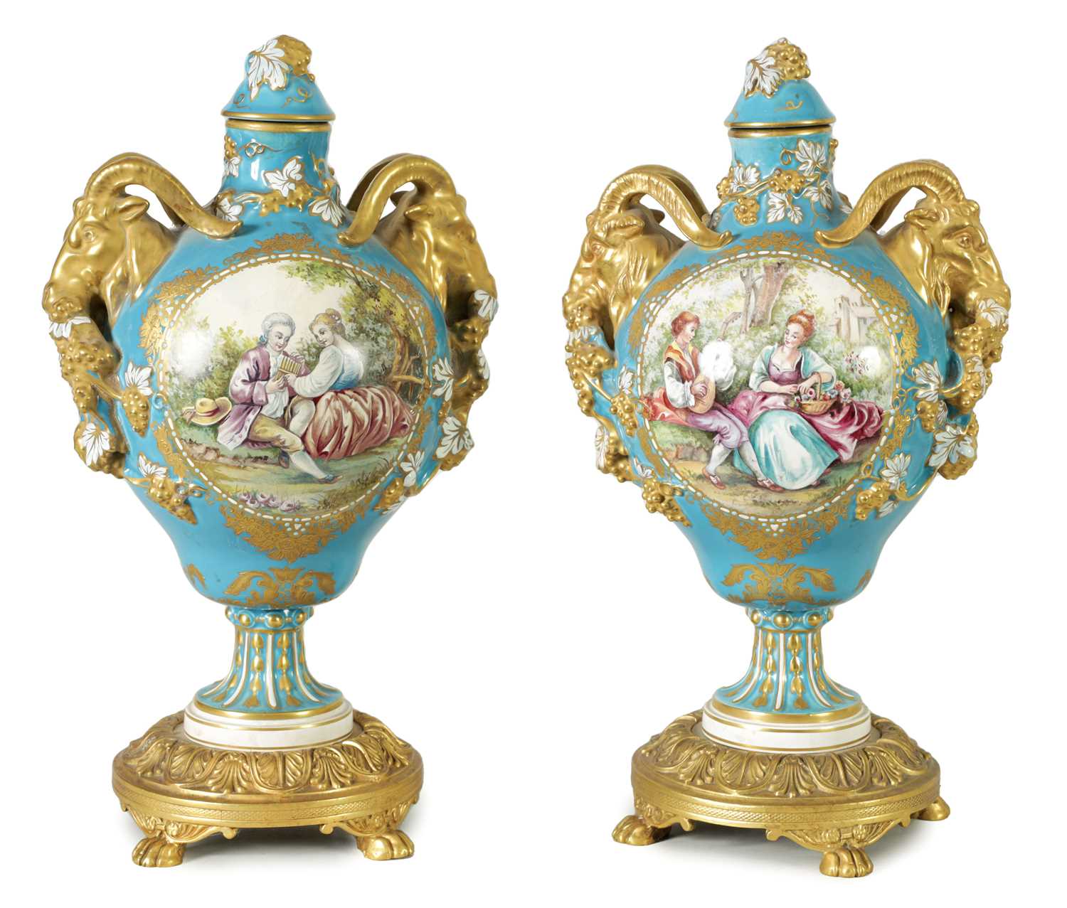 A PAIR OF 19TH CENTURY SEVRES STYLE ORMOLU MOUNTED VASES AND COVERS