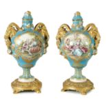 A PAIR OF 19TH CENTURY SEVRES STYLE ORMOLU MOUNTED VASES AND COVERS