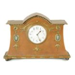AN ARTS AND CRAFTS COPPER AND BRASS CASED MANTEL CLOCK
