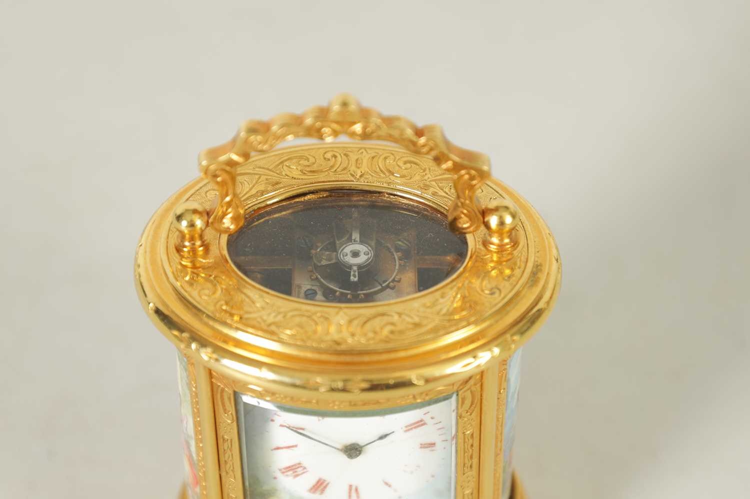 A LATE 19TH CENTURY MINIATURE PORCELAIN PANELLED ENGRAVED OVAL CARRIAGE CLOCK - Image 4 of 8