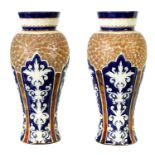 A PAIR OF DOULTON LAMBETH STONEWARE TAPERED SHOULDERED VASES WITH FLARED NECKS