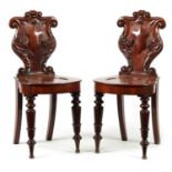 A PAIR OF WILLIAM IV MAHOGANY HALL CHAIRS