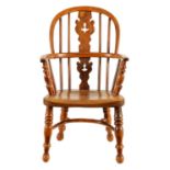 A 19TH CENTURY CHILD'S YEW-WOOD WINDSOR CHAIR