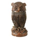 A 19TH CENTURY CARVED WALNUT BLACK FOREST OWL