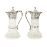 A GOOD PAIR OF LATE VICTORIAN SILVER-MOUNTED CUT GLASS CLARET JUGS