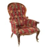 A VICTORIAN UPHOLSTERED MAHOGANY ARMCHAIR