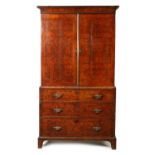 A GEORGE I HERRING-BANDED BURR WALNUT CABINET ON CHEST