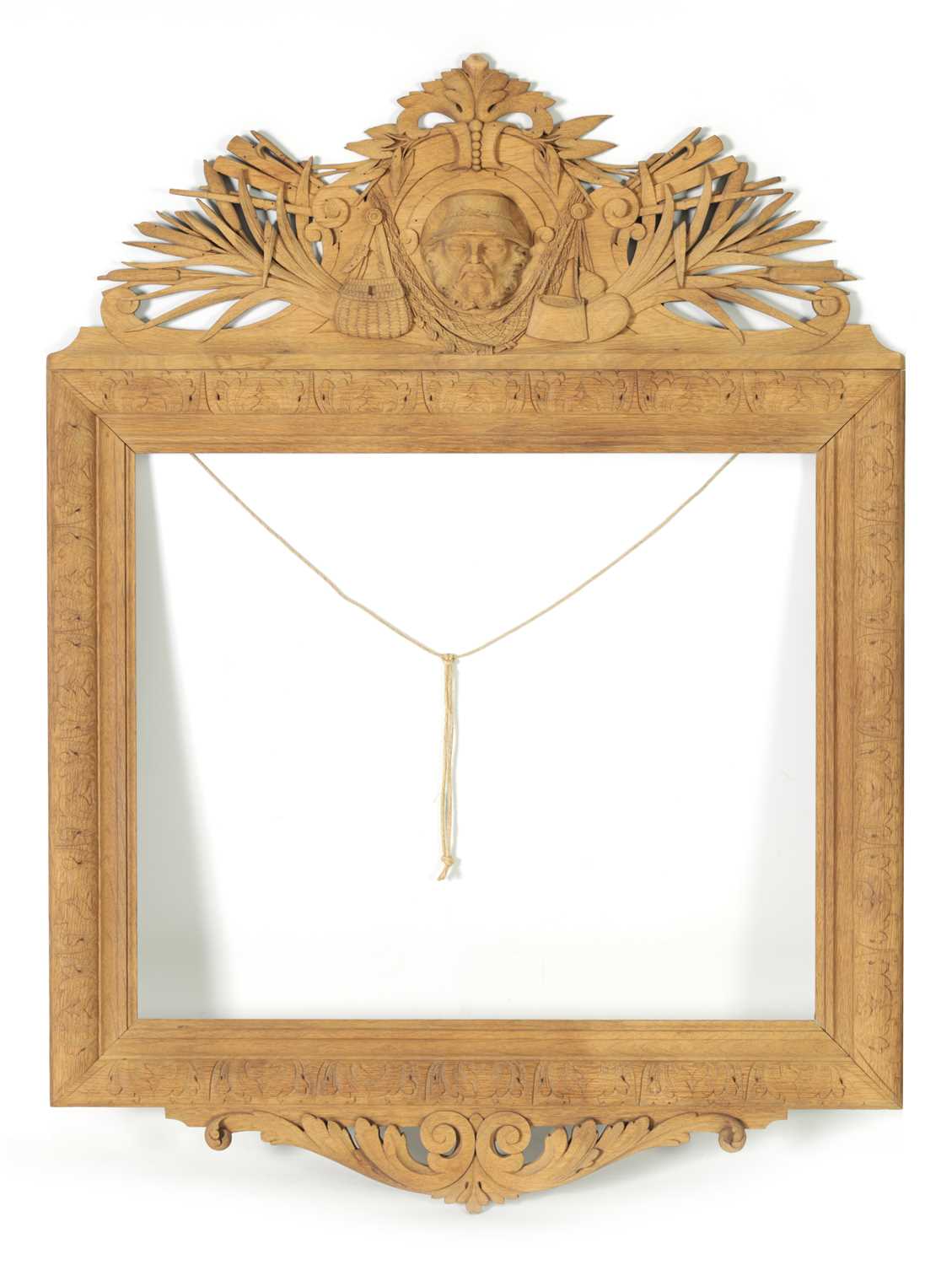 A LATE 19TH CENTURY CARVED OAK BLACK FOREST FRAME