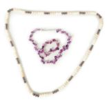 A PURPLE FRESHWATER PEARL SET TOGETHER WITH A LONG SET OF TRI-COLOUR FRESHWATER PEARLS