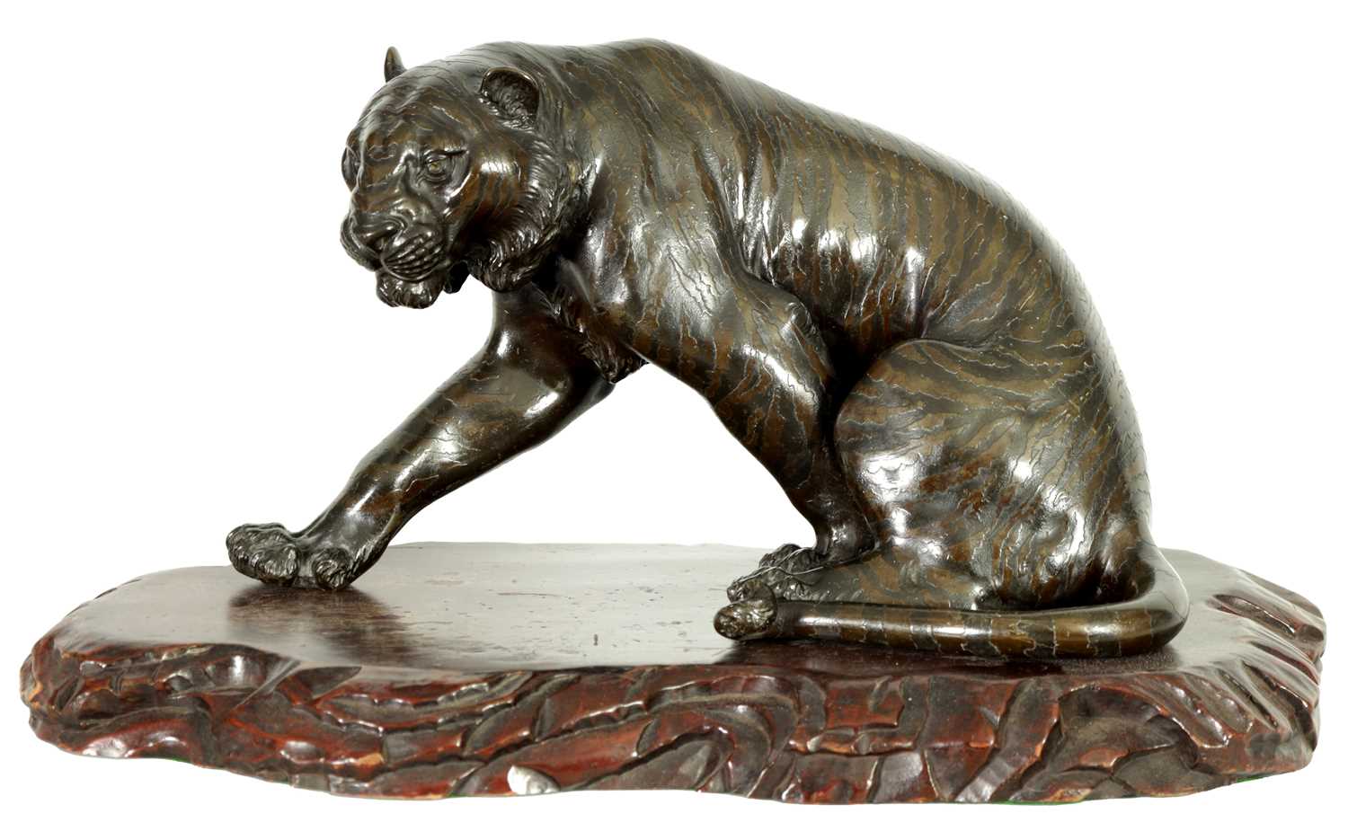 AN UNUSUAL JAPANESE MEIJI PERIOD BRONZE SCULPTURE OF A SEATED TIGER