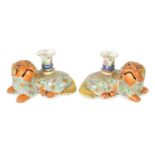 A PAIR OF 19TH CENTURY CHINESE PORCELAIN SPILL VASES FORMED AS RECUMBENT FOO DOGS