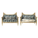 A FINE PAIR OF 19TH CENTURY CARVED GILT GESSO TWO-SEATER SETTEES