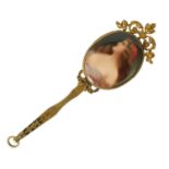 A LATE 19TH CENTURY VIENNA PORCELAIN AND GILT METAL MINIATURE HAND MIRROR